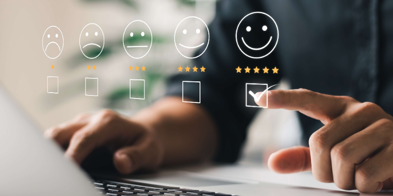 Image of a man selecting a smiley face icon with five stars under it to give a positive review for a bank's reputation management services.